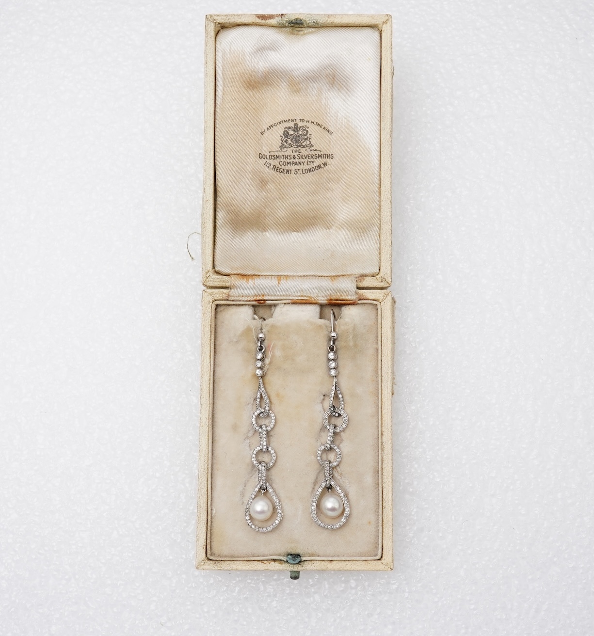 Attributed to Maurice Robin & Cie, a fine and rare pair of Art Deco natural pearl and diamond earrings, Paris, circa 1920